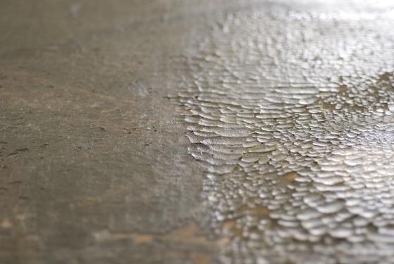 Procés de fixació d'una pintura sobre tela